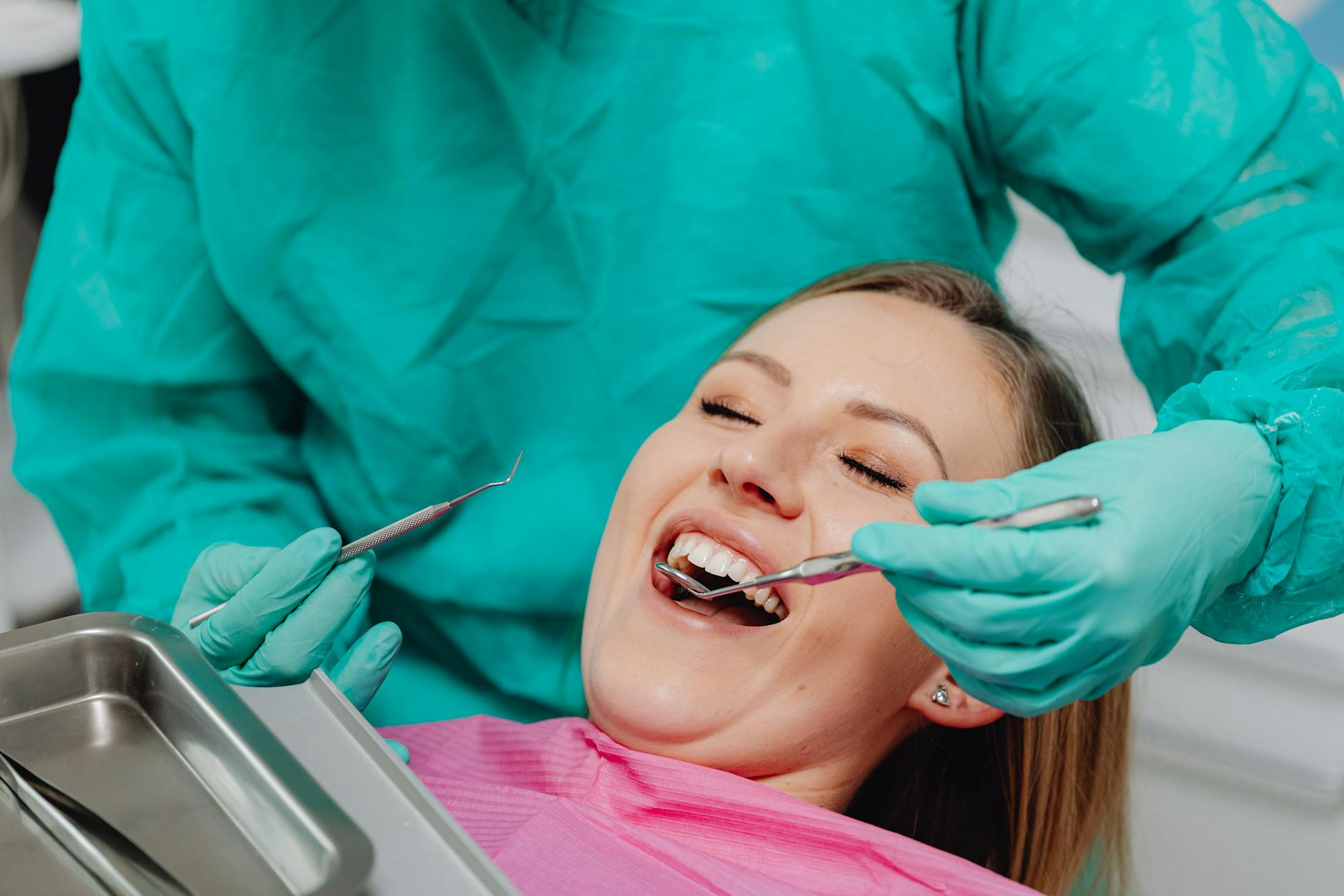 a happy woman getting a dental check up